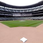 Second base sits in its place in an otherwise empty T-Mobile Park in Seattle where grounds crew members continue to keep the Mariners field in playing shape as the ballpark goes into its seventh week without baseball played because of the coronavirus outbreak. (AP Photo/Elaine Thompson)