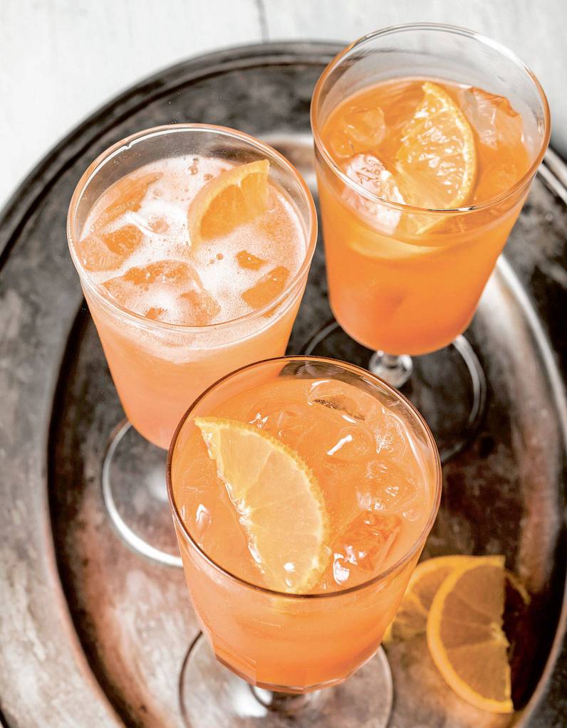 Now that the weathers warmed up, whip up a tangerine spritz with a recipe from Drinking French by David Lebovitz. (Ed Anderson)