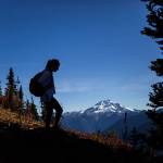 Montana Hawksford takes a break on during a hike to Green Mountain Lookout in October 2015, near Darrington. (Olivia Vanni / Herald file photo)