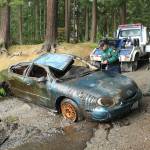 A Ford Taurus was pulled from the muddy depths of Goss Lake on May 21. (Whidbey News-Times)