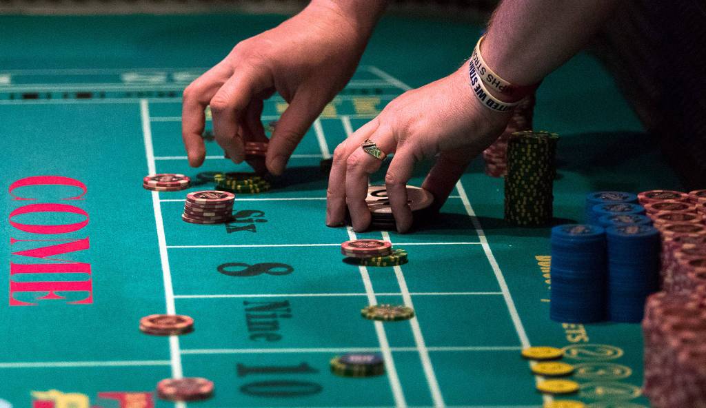 Gamblers place their bets as the Tulalip Resort Casino reopens Tuesday. (Andy Bronson / The Herald)