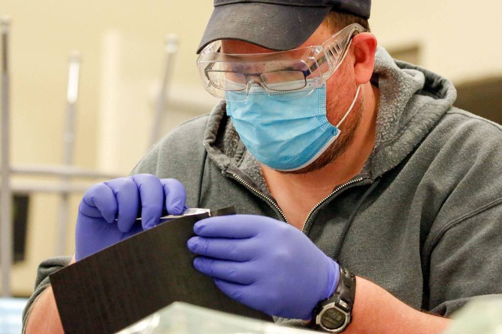 Brendan Fellows works on an assignment at the Advanced Manufacturing Training & Education Center at Everett Community College. (Kevin Clark / The Herald)