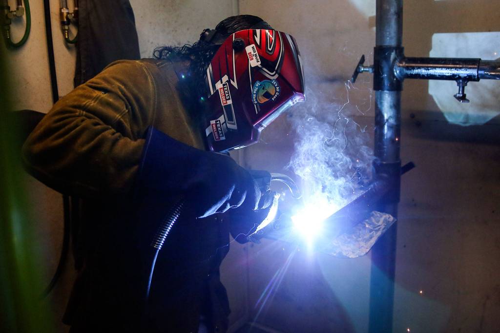 Joesph LaFond works on an assignment at the Advanced Manufacturing Training & Education Center at Everett Community College. (Kevin Clark / The Herald)