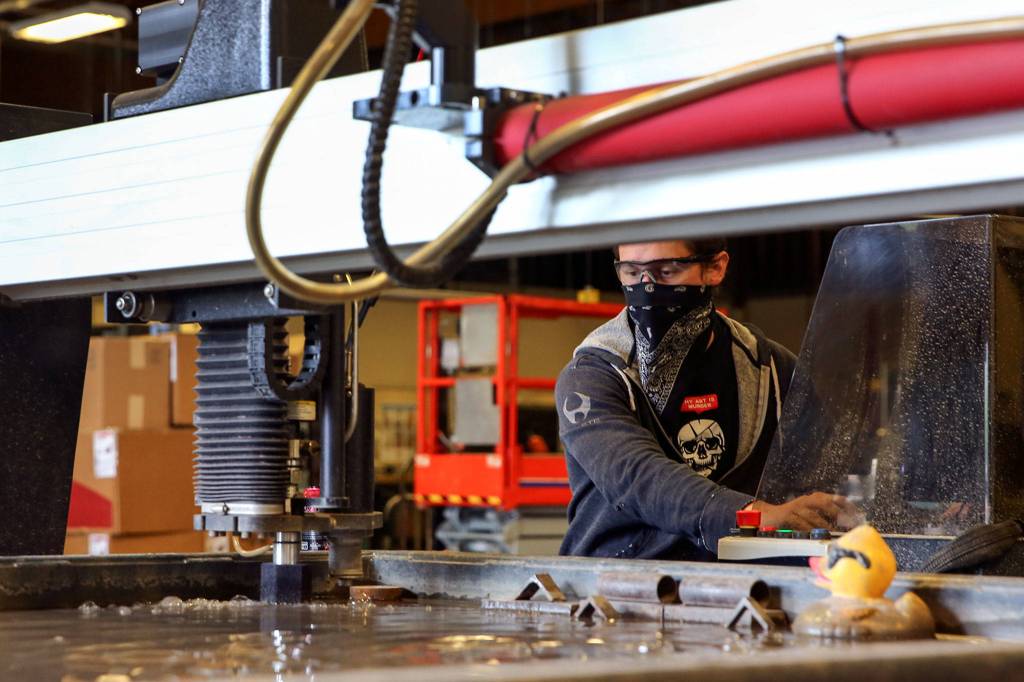 Thomas Zajicek works on an assignment at the Advanced Manufacturing Training & Education Center at Everett Community College. (Kevin Clark / The Herald)