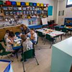 Lauren McGee leads a lesson with children at Starbright Early Learning Center in Everett. This class would normally have 15 children, but enrollment has dropped significantly due to COVID-19. (Olivia Vanni / The Herald)