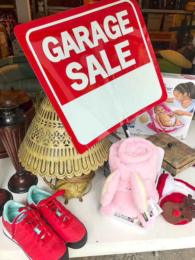 A yard sale table in Mukilteo. (Andrea Brown / The Herald)