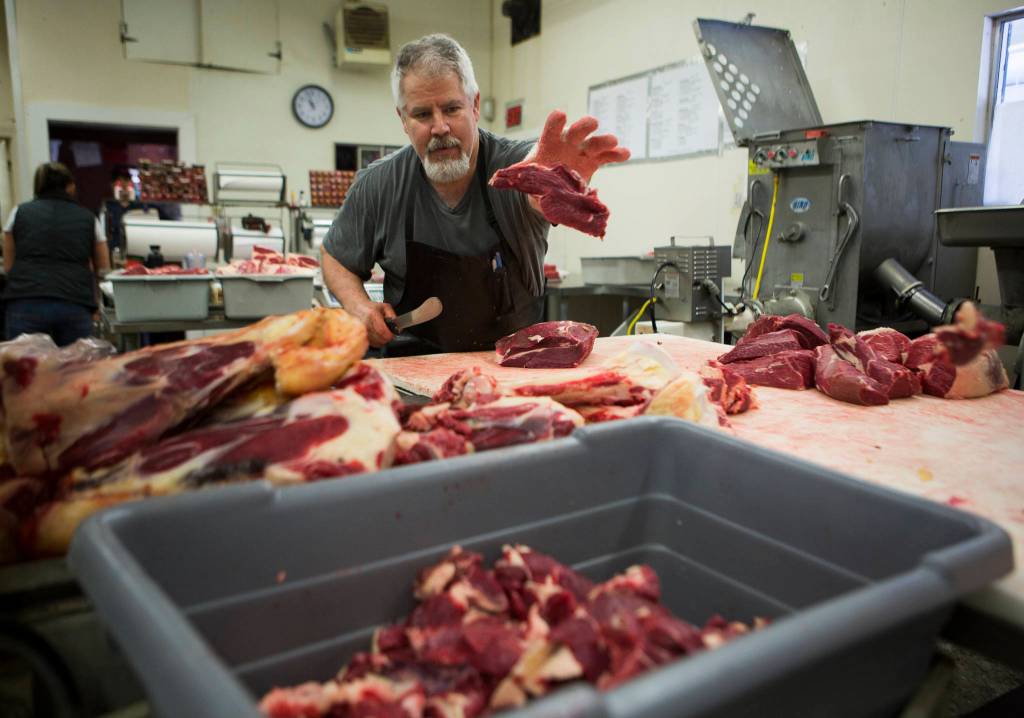 Mike Parker processes beef at Silvana Meats on Friday, May 29, 2020 in Silvana, Wa. (Olivia Vanni / The Herald)