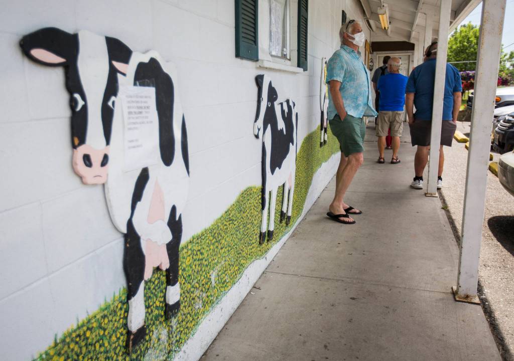 Customers wait outside of Silvana Meats on Friday, May 29, 2020 in Silvana, Wa. (Olivia Vanni / The Herald)