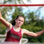 Cascades Katie Nelson winds up for the high jump during the 3A/4A NW District Track and Field Championships on May 17, 2019, at Shoreline Stadium. (Kevin Clark / The Herald)