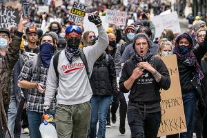 Inslee embraces peaceful demonstrators, condemns looters