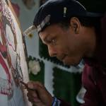 Julius Wilsons artwork can be seen at Zoeys Fried Chicken Sandwiches on Casino Road in south Everett. (Andy Bronson / The Herald)