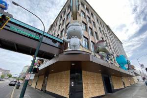 Protests continue as Inslee backs review of police actions