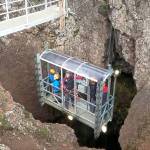 A lift lowers visitors on the Inside the Volcano tour 400 feet down into a vast, colorful chamber in the dormant Thrihnukagigur volcano. (Rick Stevs Europe)