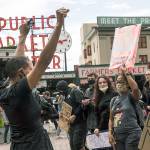 Protesters continue past Pike Place Market during the #SeattleJusticeForGeorgeFloyd march Saturday in Seattle. The death of George Floyd at the hands of police last month in Minneapolis has sparked nationwide protests for police reform. (Amanda Snyder/The Seattle Times via AP)