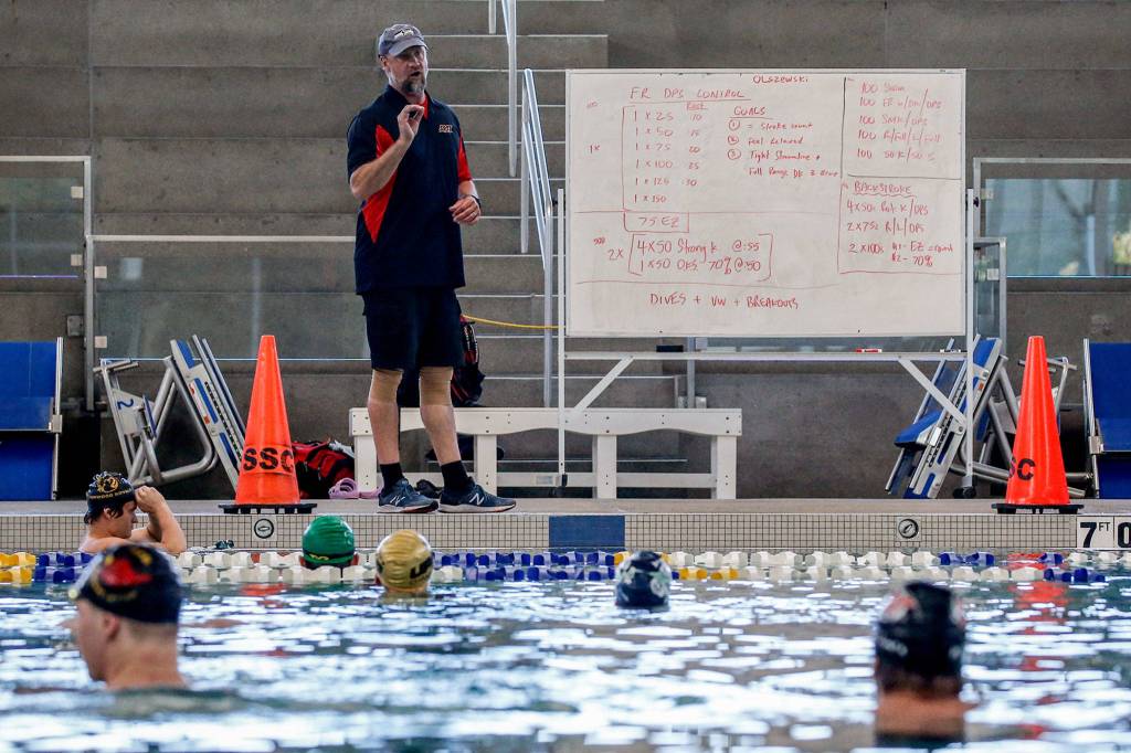 Ben Olszewski leads a practice of the StingRay Swim Team at Snohomish Aquatic Center Wednesday afternoon in Snohomish. (Kevin Clark / The Herald)