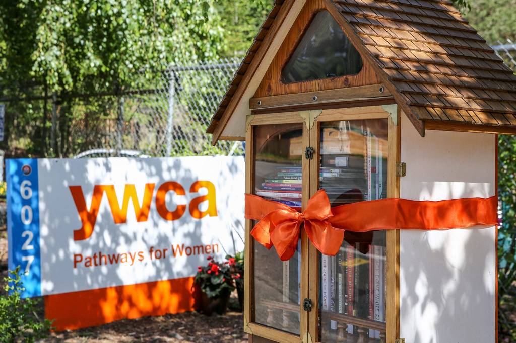 The newly opened Little Free Library will focus on books about racial inequity and social justice at the YWCA Pathways for Women in Lynnwood. (Kevin Clark / The Herald)