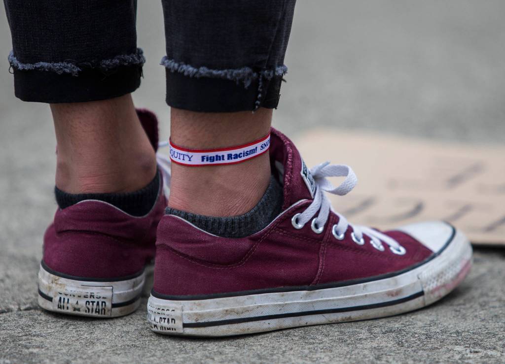 Anjuli Kajla, wares a Fight Racism ankle band during the Juneteenth protest on Friday, June 19, 2020 in Snohomish, Wa. (Olivia Vanni / The Herald)