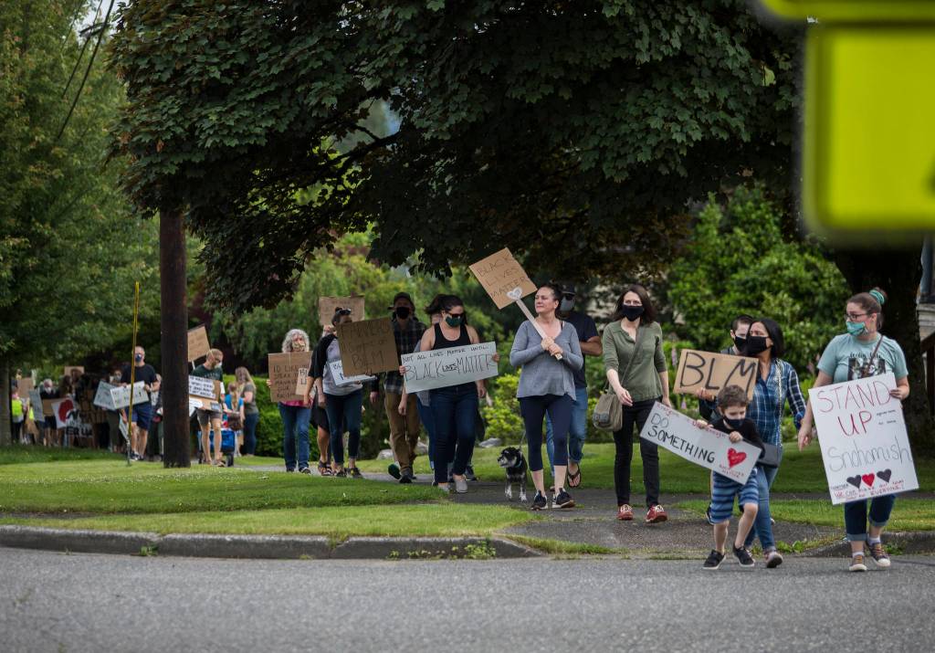 Protester make their way up Avenue D on their way to Snohomish High School on Friday, June 19, 2020 in Snohomish, Wa. (Olivia Vanni / The Herald)