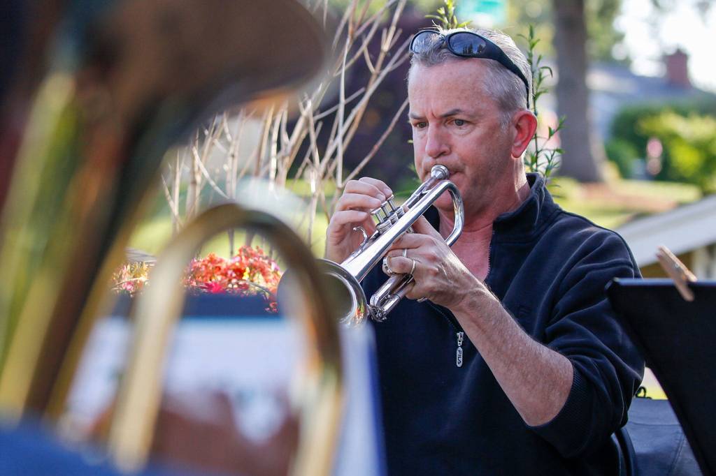 Jake Bergevin plays during the Thursday night concert from his deck in Everett on June 25, 2020. (Kevin Clark / The Herald)
