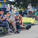 Kay and Dean Olsen (at left) join other neighbors as they listen to bands playing from Jake Bergevins deck Thursday evening in Everett on June 25, 2020. (Kevin Clark / The Herald)