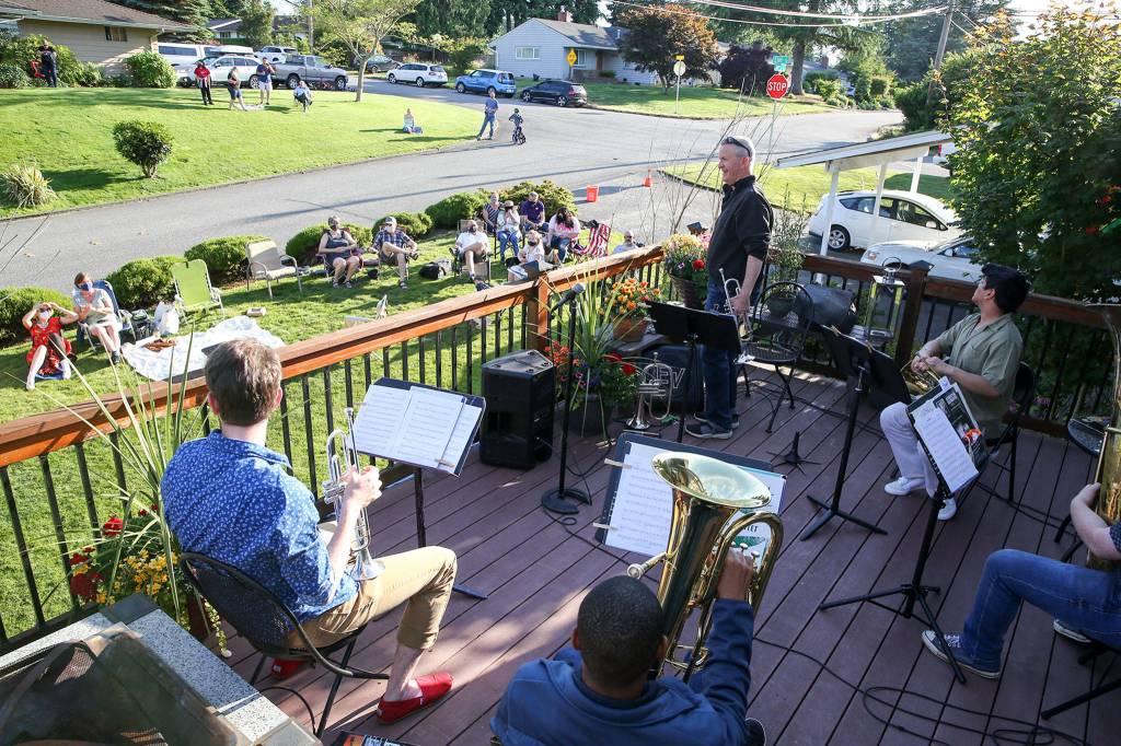Jake Bergevin introduces musicians during the Thursday night concert in Everett on June 25, 2020. (Kevin Clark / The Herald)