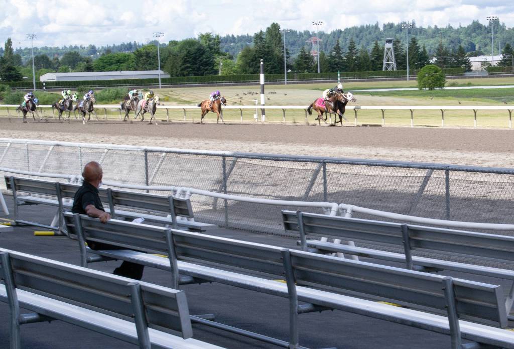 Doug Parry photo                                Horses battle down the stretch in front of a lone spectator in the sixth race this past Wednesday at Emerald Downs in Auburn. The event took place with no fans in the stands.