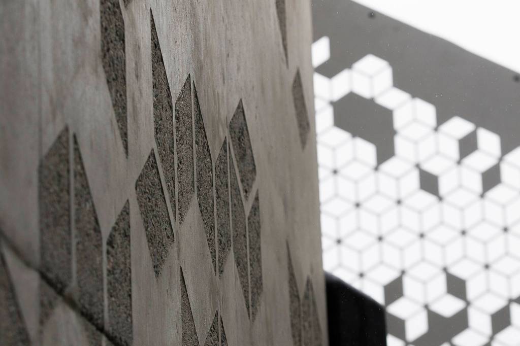 Concrete details match the hand rails at the Grand Avenue Park Bridge on Wednesday in Everett. The city expects the walkway to open for use this summer. (Andy Bronson / The Herald)