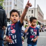 Micah West, 5, and Jaymen West, 5, react to a helicopter float July 4, 2019, during the Colors of Freedom Fourth of July Parade in Everett. (Olivia Vanni / The Herald)