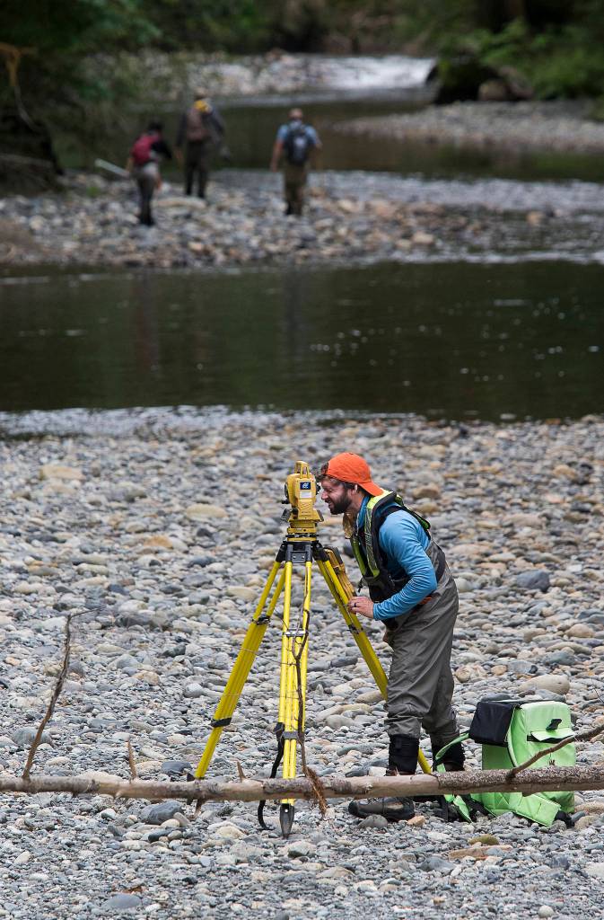 With Pilchuck Dam removal to begin soon, the U.S. Geological Survey&rsquo;s Scott Anderson surveys the Pilchuck River in Granite Falls. (Andy Bronson / The Herald)
