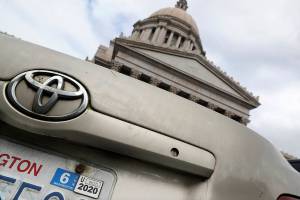 High court weighs legality of voter-approved car tab measure