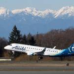 With the Olympic mountains in the background, passenger Alaska Airlines Flight 2878 departs for Portland from Paine Field Terminal on March 4, 2019 in Everett. (Andy Bronson / Herald file)