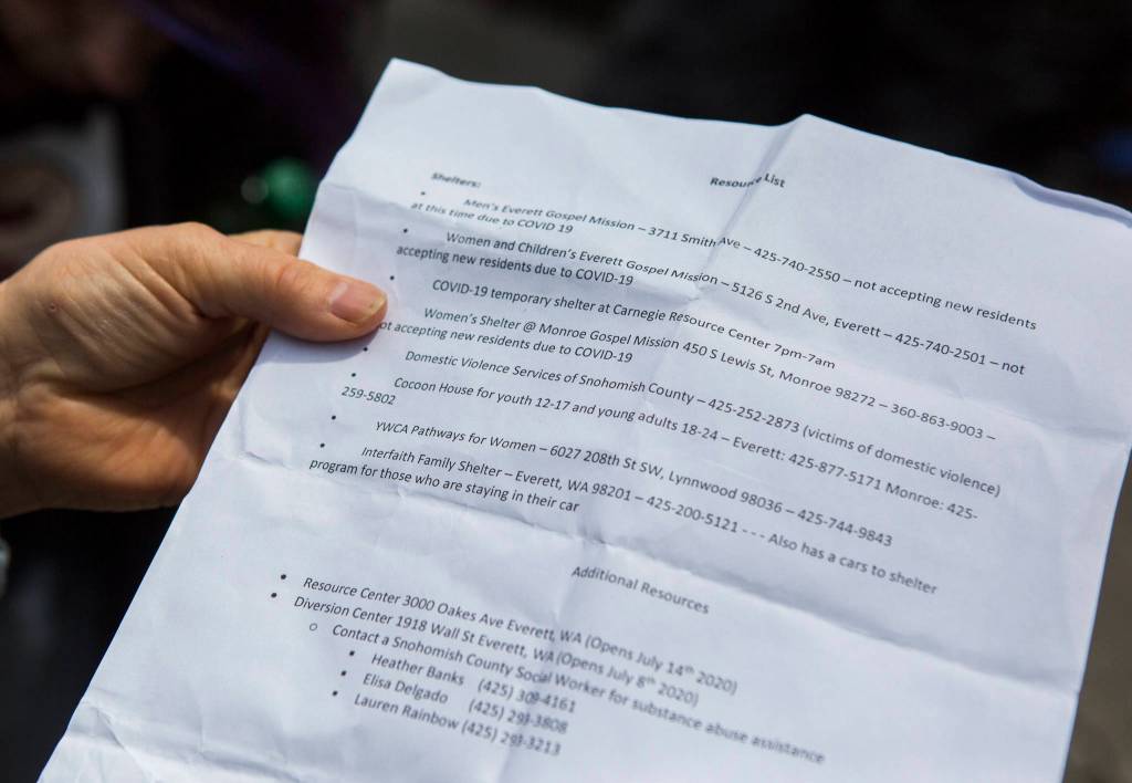 This flyer with a list of resources was handed out at a downtown Everett homeless encampment on Thursday. (Olivia Vanni / The Herald)