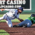 The AquaSoxs Connor Hoover tags the Emeralds Pedro Martinez out at second base during a game Aug. 25, 2019, at Funko Field in Everett. (Olivia Vanni / The Herald)