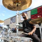 Chris Anderson plays the drums on a rooftop as part of the weekly Black Lives Matter rally in Marysville on July 4. (Kevin Clark / The Herald)