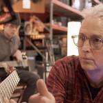 Mike McCready of the band Pearl Jam records a song with Treehouse participants (left) Sergio and (center) Joseph. (Treehouse)