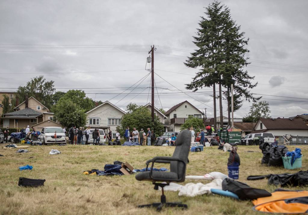 After residents departed, garbage bags and leftover items cover the lot of a homeless camp on Thursday in Everett. (Olivia Vanni / The Herald)