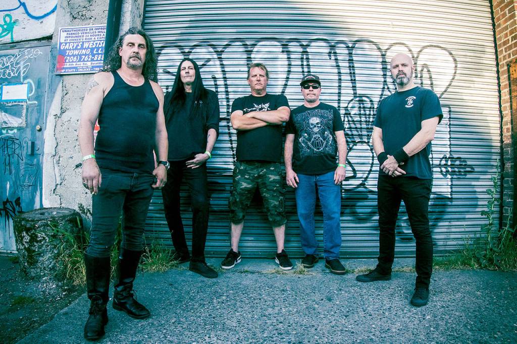 The members of Pain Field, which will perform a live-stream show Thursday at Adams Manor in Snohomish, are (from left) Morgen Gallagher, Mark Mathiasen, Colin Mattson, Brian Majors and Steve Campbell. (Kurt Clark / Optical Ninja)