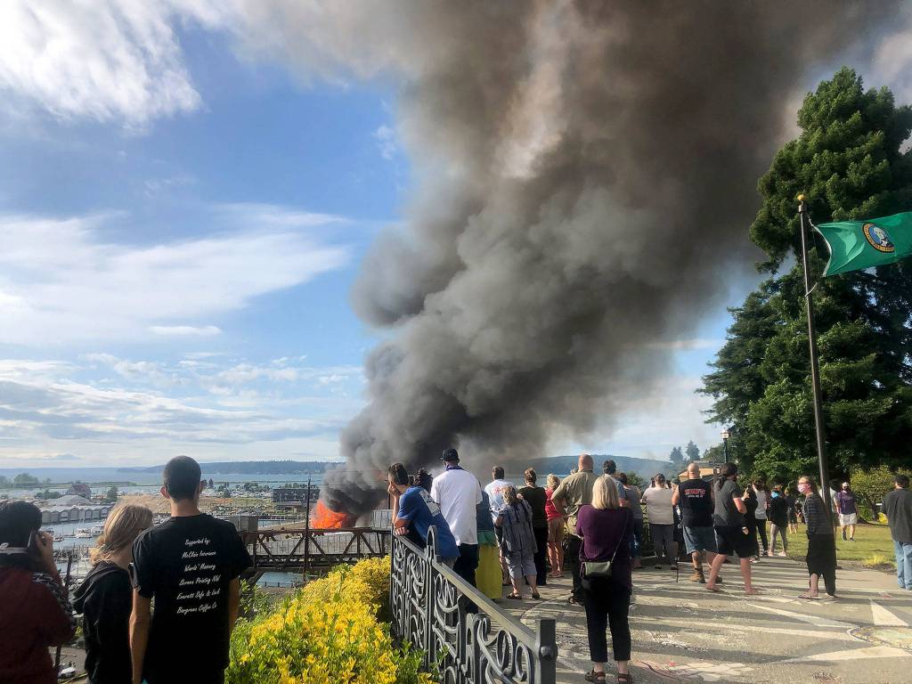 The under-construction Waterfront Place Apartments in Everett went up in flames Thursday evening. (Julia-Grace Sanders / The Herald)