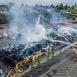 Smoke rises from the under-construction Waterfront Place Apartments that caught fire along Marine View Drive on Thursday in Everett. (Olivia Vanni / The Herald)