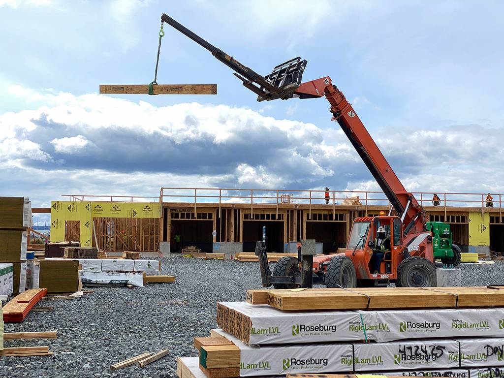 The Waterfront Place Apartments is seen under construction on May 14. (Sue Misao / Herald file) 200514
