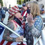 A supporter (left) and a protester face off during the rally to support law enforcement and first responders sponsored by The Outreach Committee of the Snohomish County Republican Party Friday at the Snohomish County Plaza in Everett on July 17, 2020. (Kevin Clark / The Herald)