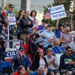 Supporters cheer during the law enforcement and first responders rally sponsored by The Outreach Committee of the Snohomish County Republican Party Friday at the Snohomish County Plaza in Everett on July 17, 2020. (Kevin Clark / The Herald)
