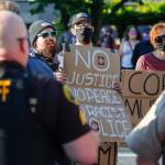 Protesters confront supporters of law enforcement and first responders rally Friday at the Snohomish County Plaza in Everett on July 17, 2020. (Kevin Clark / The Herald)