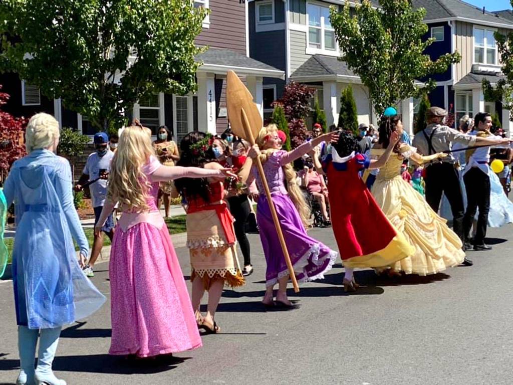 Costumed characters from Enchanting Events volunteered their time to be in the parade for Avery Garcia-Valentin, 5, whose wish was to go to Disneyland. (Suhani Pillay)