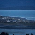 Headlights from a line of cars shine at dusk as people evacuate the Spit in Homer, Alaska, following a powerful earthquake in the Aleutian Islands that prompted a tsunami warning. (Pat Williams Russell via AP)