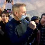 Mayor Ted Wheeler speaks to people gathered in downtown Portland, Oregon on Wednesday. (AP Photo/Gillian Flaccus)
