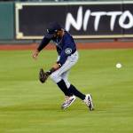 Mariners right fielder Mallex Smith tries to catch a ball hit by the Astros Josh Reddick during the fourth inning of a game July 25, 2020, in Houston. (AP Photo/David J. Phillip)