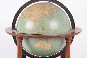 This terrestrial globe was made by Rand-McNally in the 1930s. The stand is made of mahogany. The 17-inch globe has a calibrated meridian and a paper horizon band. It sold at Locati Auctions for $154. (Cowles Syndicate Inc.)