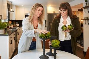 Twins Leslie Davis, left, and Lyndsay Lamb stage a house in Everett as seen on Unsellable Houses on HGTV. (HGTV photo)