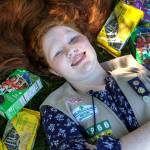 Preorders are Aly Gustavsons cookie-selling secret. This year, she added a QR code to her door hangers that enabled her repeat customers to purchase Girl Scout cookies from her online. (Kevin Clark / The Herald)